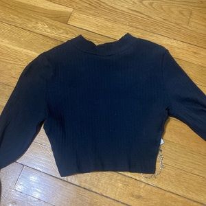 Black top with open back and rhinstone chain.